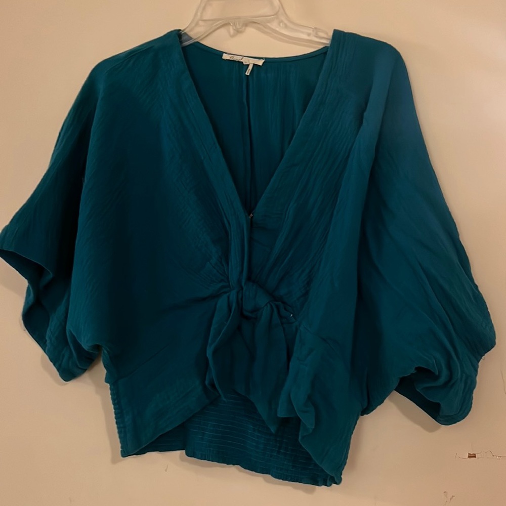 Blue cotton Anthropologie top with tie front and clasp, never worn.